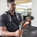 Operator holding a GoHigh 135-degree bend with round dust brush in an office